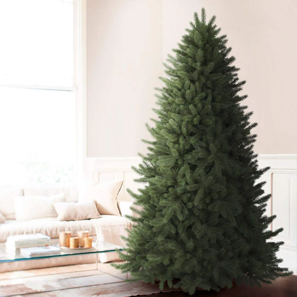 A full, lush artificial Christmas tree with realistic molded tip branches
